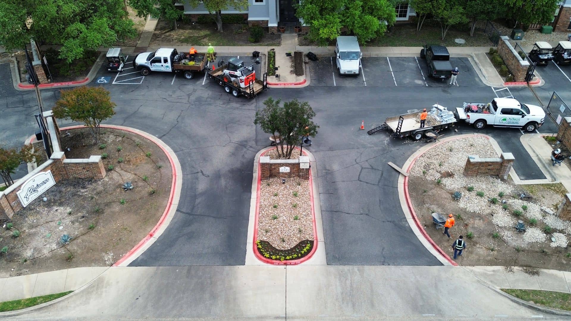 An aerial view of a parking lot with trucks parked in it.